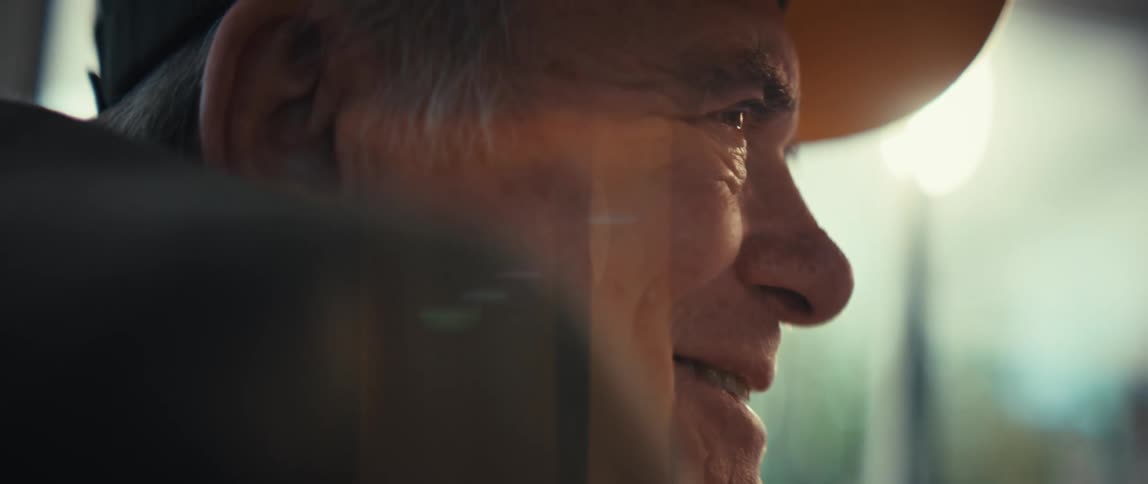 The man is smiling at home