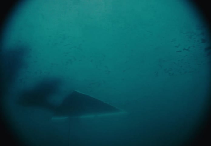 Underwater view of a frozen lake
