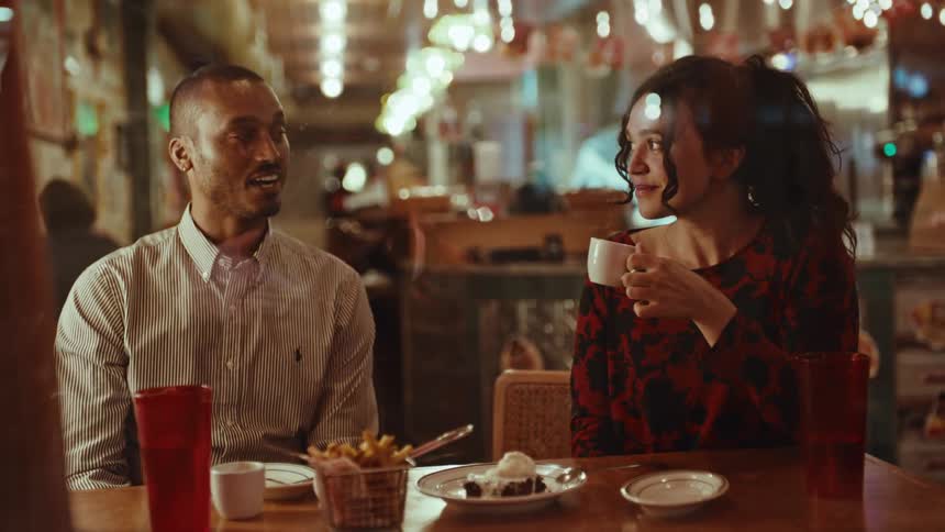The couple are on a date in the diner
