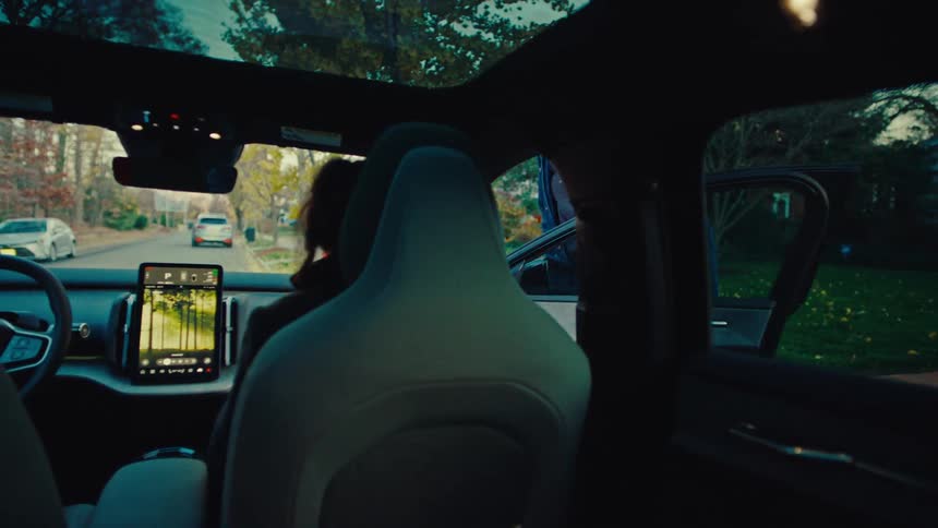 Man opens car door for woman to get in