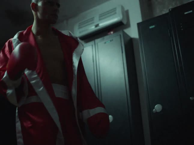 A man shadow boxing in a gym