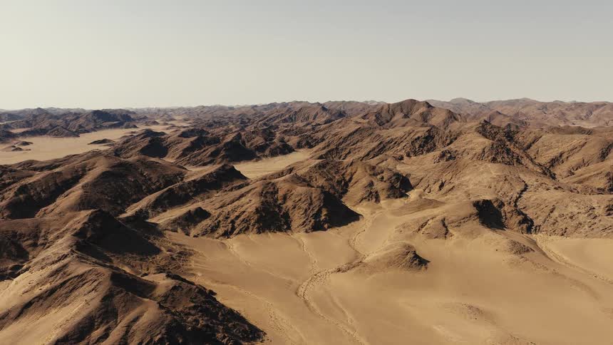 An aerial view of a mountain range in a desert
