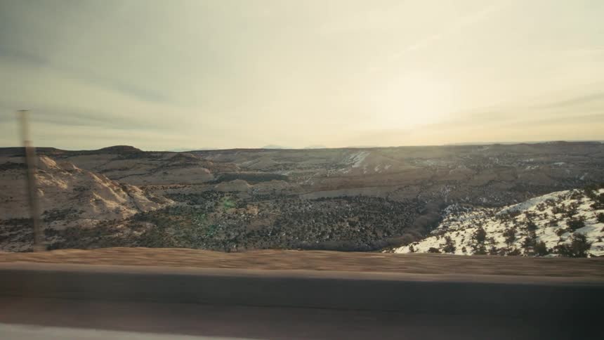 The highway is on a cliff above the landscape