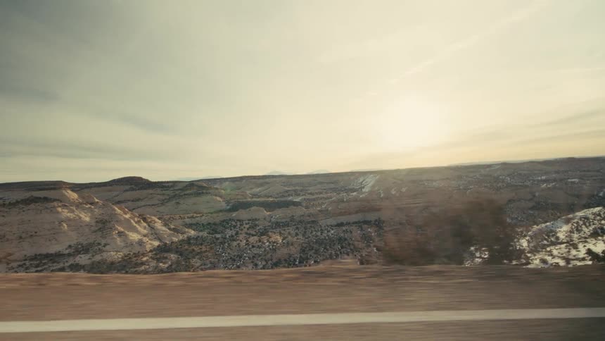 The highway is on a cliff above the landscape