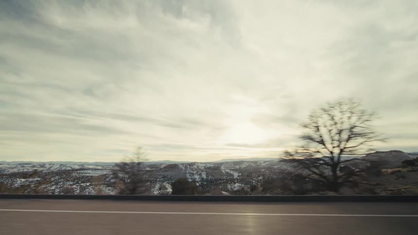 A mountain road with snow on it