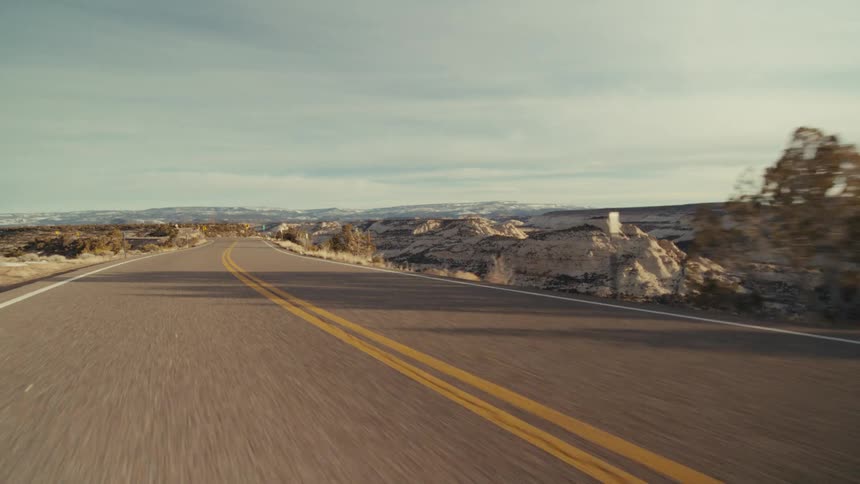 The highway is empty that runs through the canyon