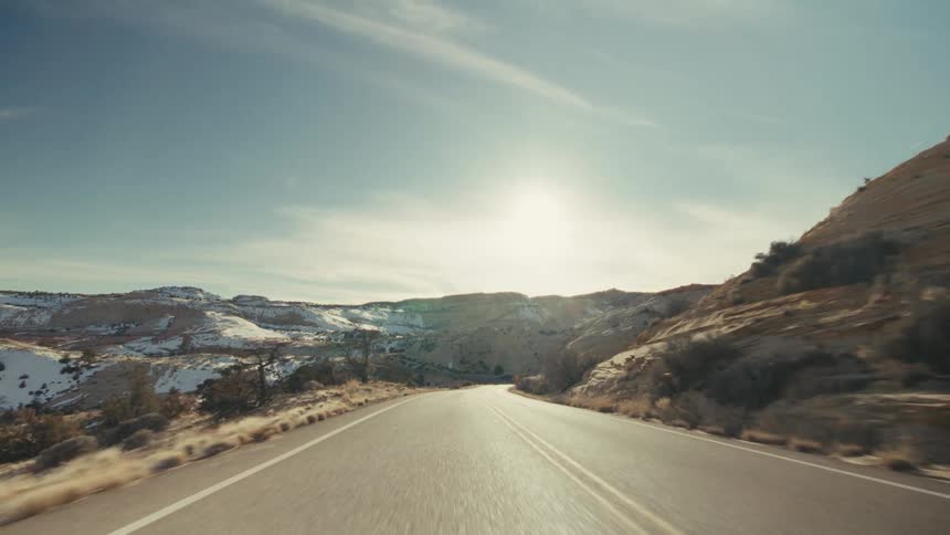 A road in a mountain covered in snow