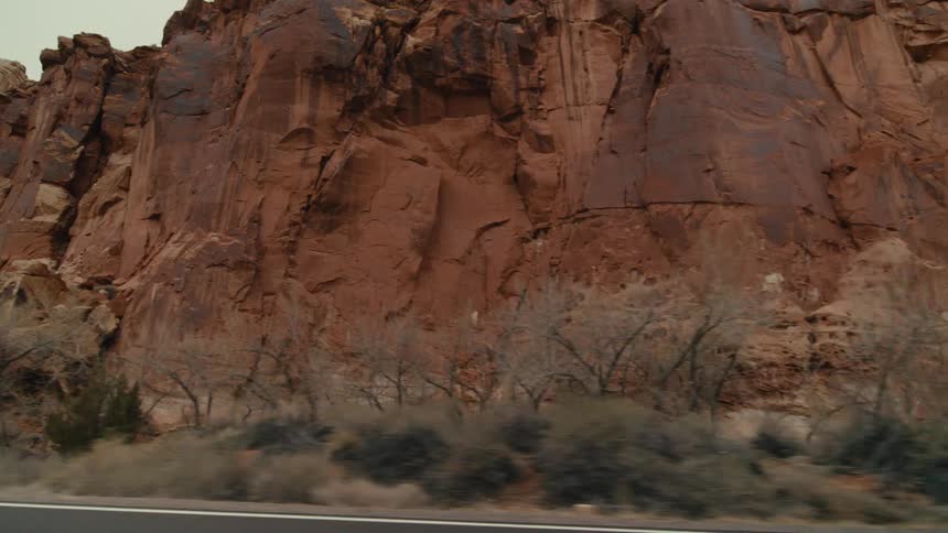 The tall mountain has a steep cliff