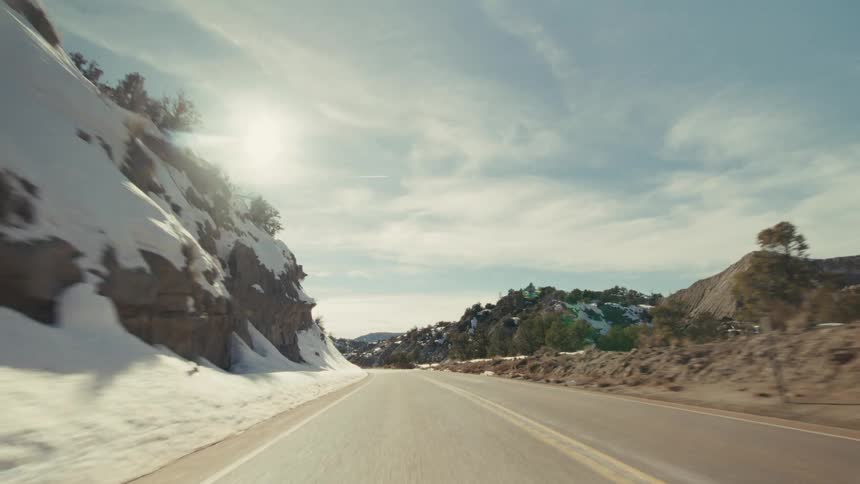 The canyons are covered in snow on a cloudy day