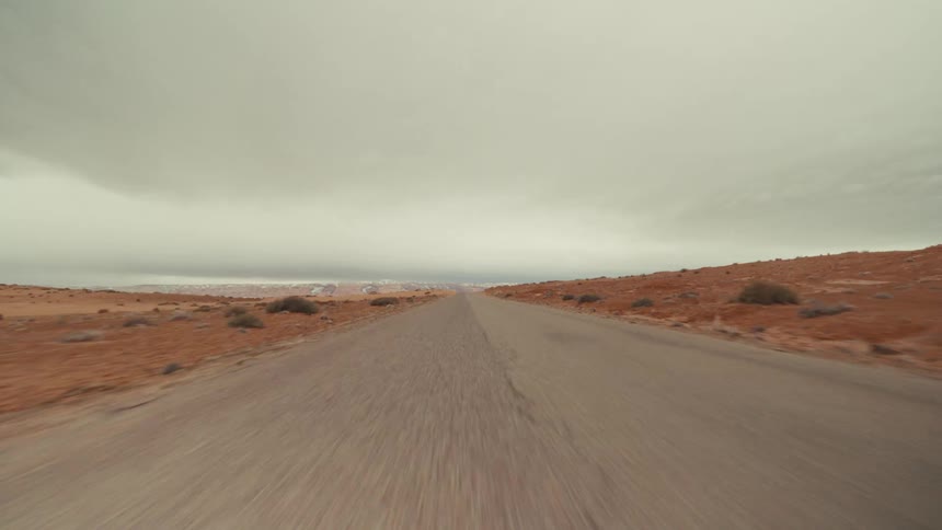 A small road runs through the desert