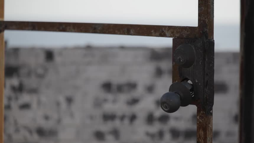 A view of a rusted door and doorhandle