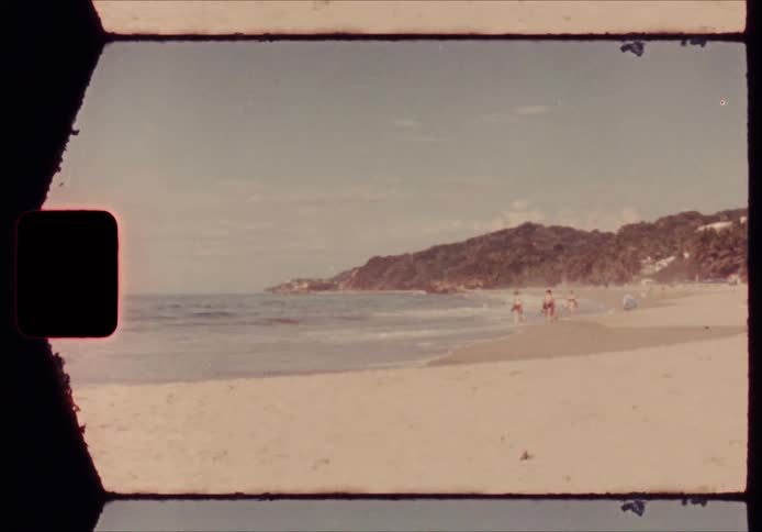 People walk on the beach on a summer day