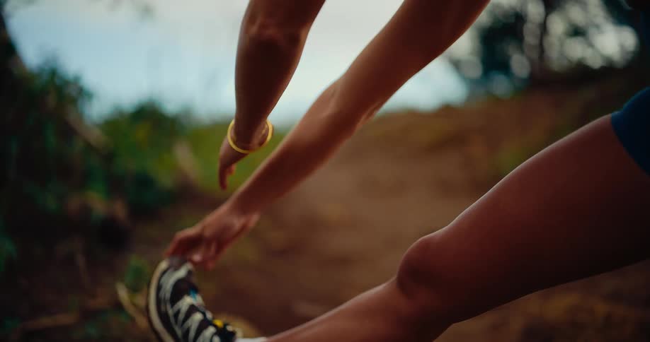 A woman stretching outdoors