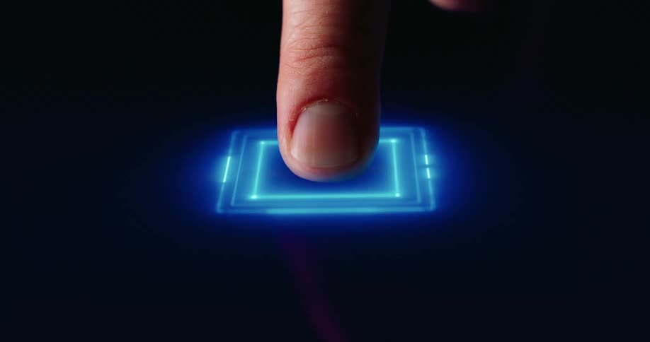 Finger touches a glowing blue interface on a dark background