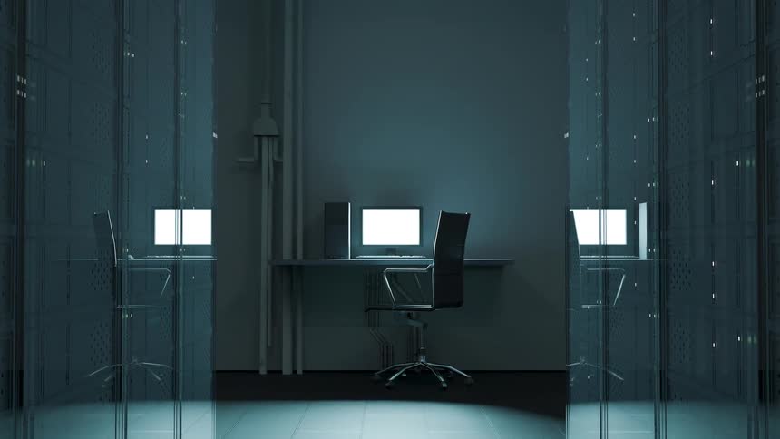 Computer sits on a desk at the end of a corridor with reflective walls