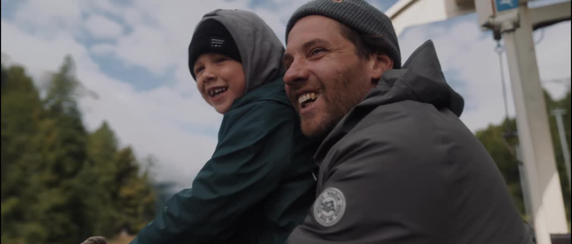 The father and son have fun riding on the vehicle
