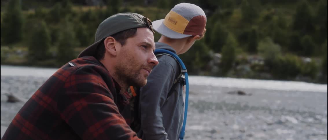 Father and son fishing in the stream