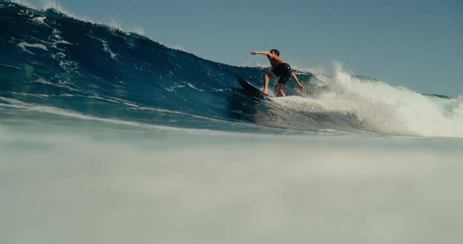 A man surfing on a large wave