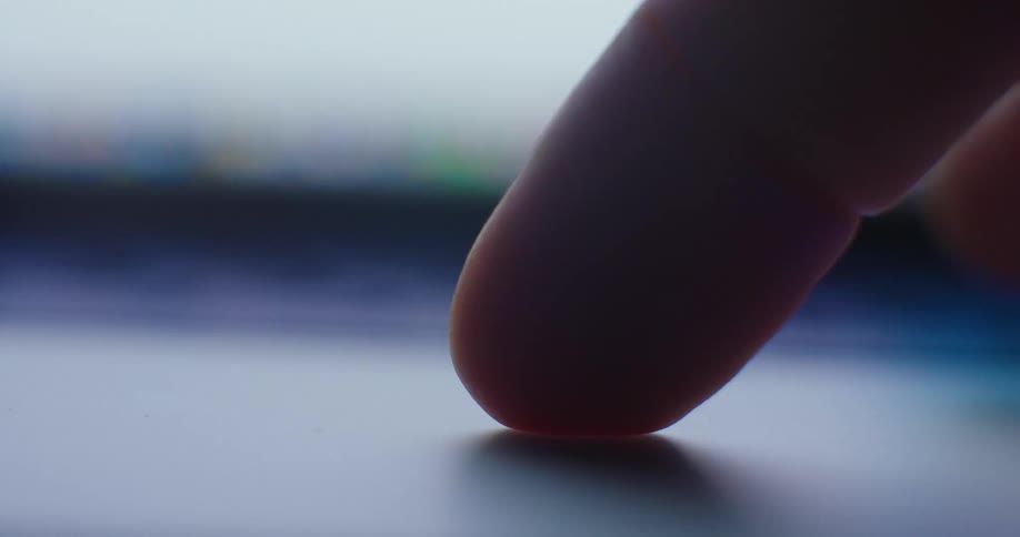 Finger touching a touchscreen surface