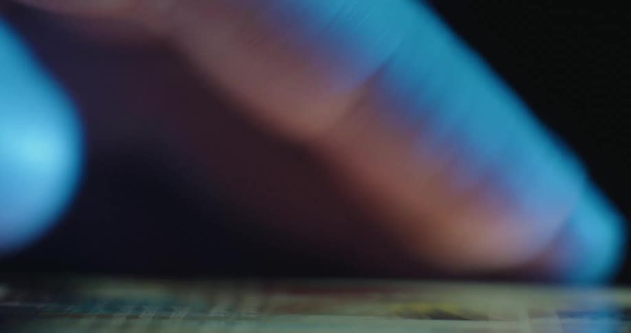Finger sliding across an illuminated touchscreen