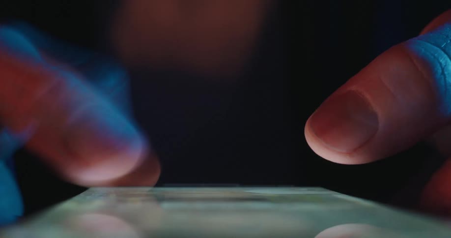 A close p of a persons thumbs scrolling quickly on a smart phone