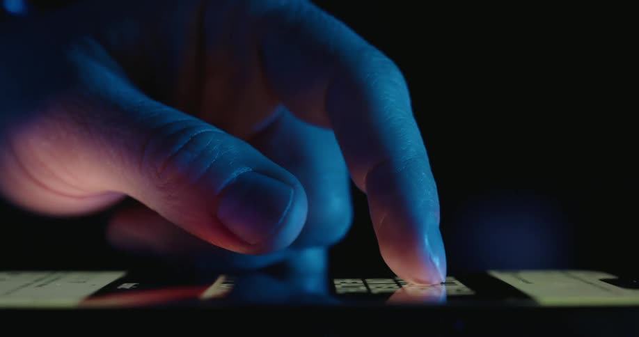 A person swipes their finger upwards across a smart phone screen
