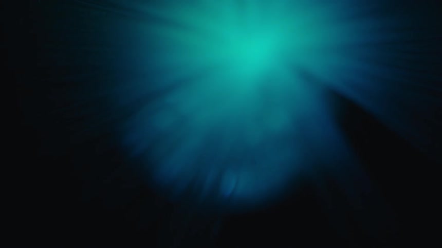 Abstract light beams shift colors and intensity against a dark background