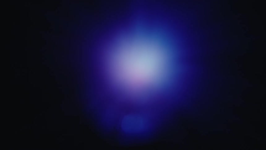 Diffuse glow forming a light gradient on a dark background