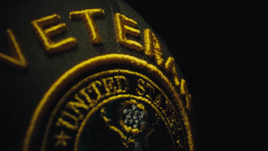 Black cap with gold veteran embroidery and united states army emblem