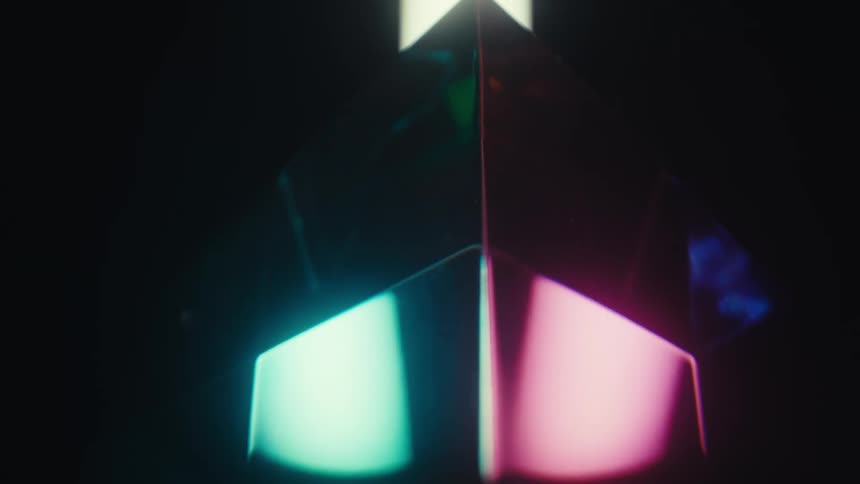 Jewelry featuring different colors illuminated in a dark room