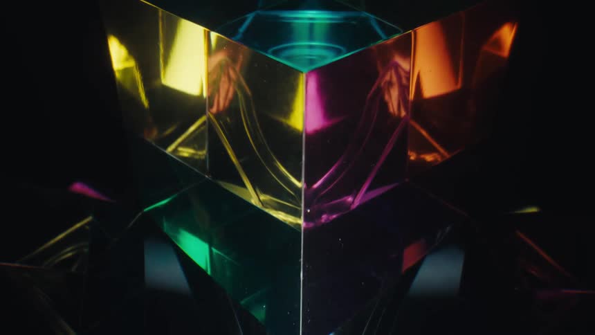 A close up of some glass cubes with orange and purple lights