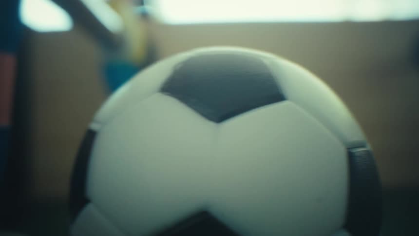 A close up of a ball on a foosball table