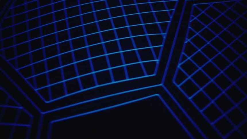 A glowing blue geometric wireframe sphere rotates against a dark background