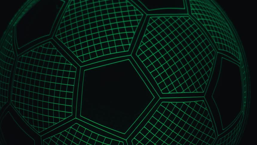 Soccer ball with a hexagon pattern illuminated in green against a dark background