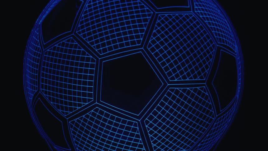 A neon blue glowing soccer ball with a grid wireframe pattern slowly zooms out from a close up to reveal its full spherical shape on a flat stand against a dark black background