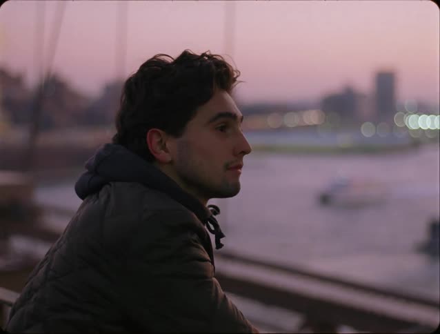 A portrait of a man looking into the distance