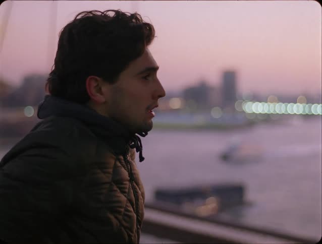 Man watching the sea at dusk