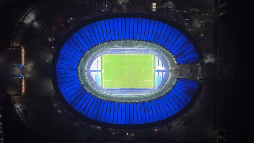 Aerial view of a soccer stadium with people in the stands