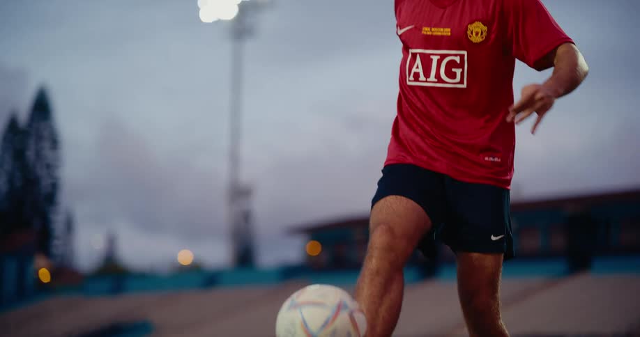 Player juggling a soccer ball on a sports field
