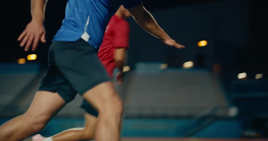 The video features two soccer players engaged in a drill or a competitive play on an outdoor turf field at night one player in a blue jersey dribbles the ball skillfully while the other in a red jersey with the name ronaldo and the number 7 on the bac