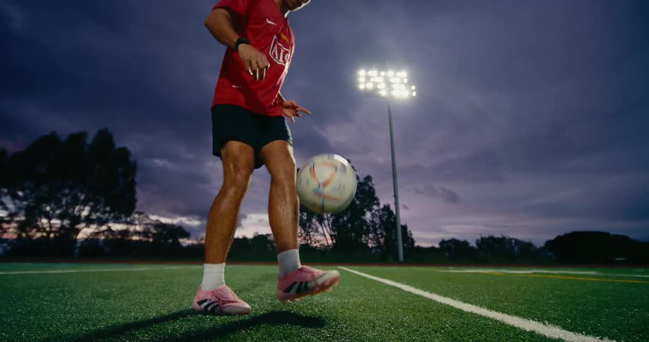A young male soccer play shows impressive ball control skills