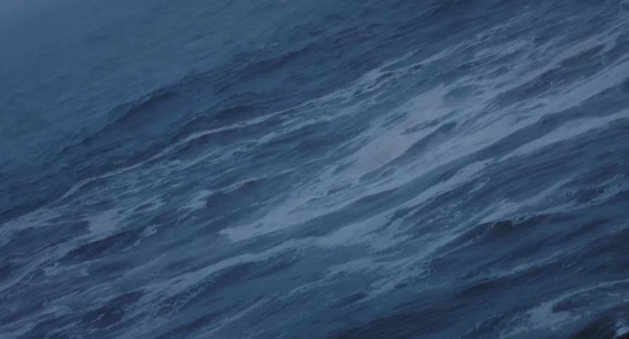 Closeup of blue ocean waves at dawn