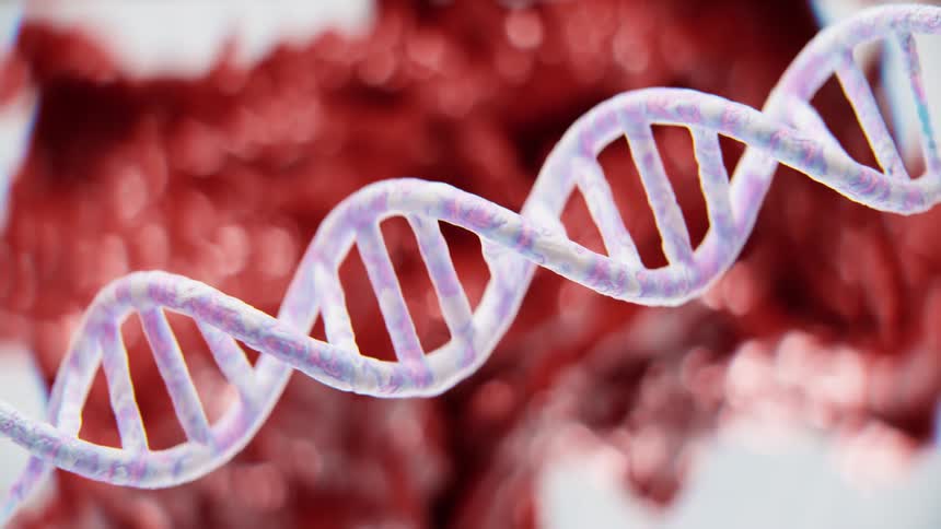 A 3d rendered model of a dna double helix rotates slowly against a blurred red background