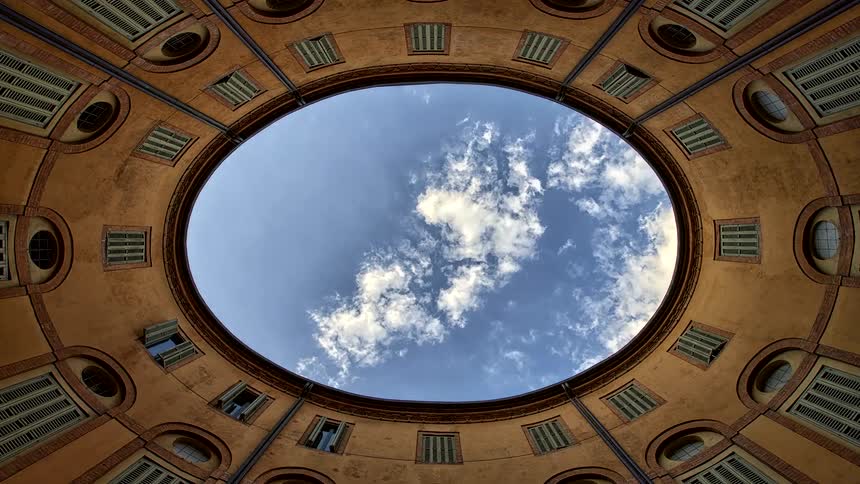 View looking up from the rotonda foschini courtyard as clouds move across the sky