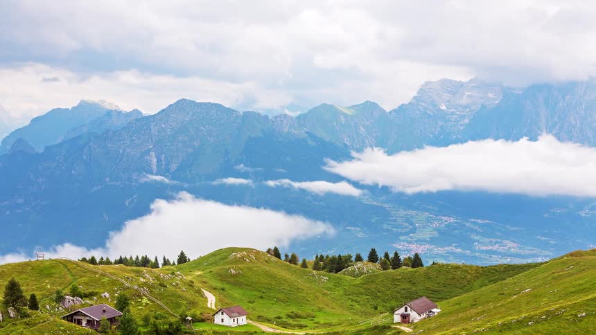 Clouds move through the mountains very low and touch the peaks