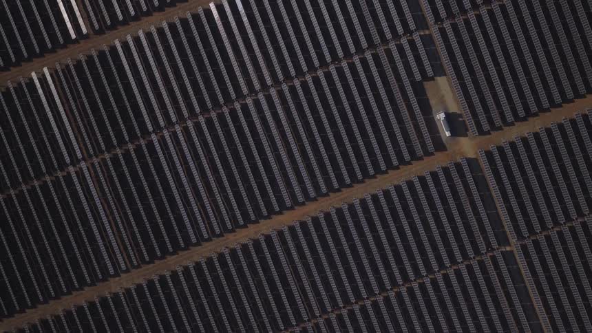 An aerial view of a field with solar panels