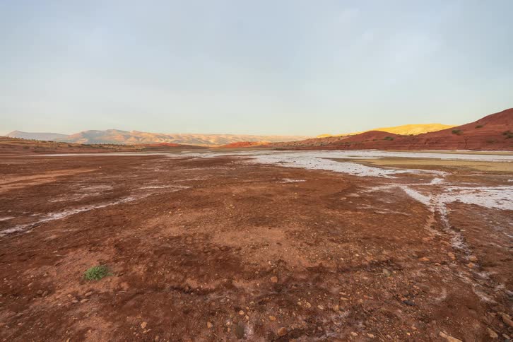 Open land with mountains stretching across the landscape
