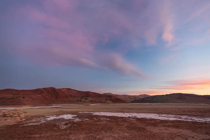A time lapse of a sunset over a mountain range