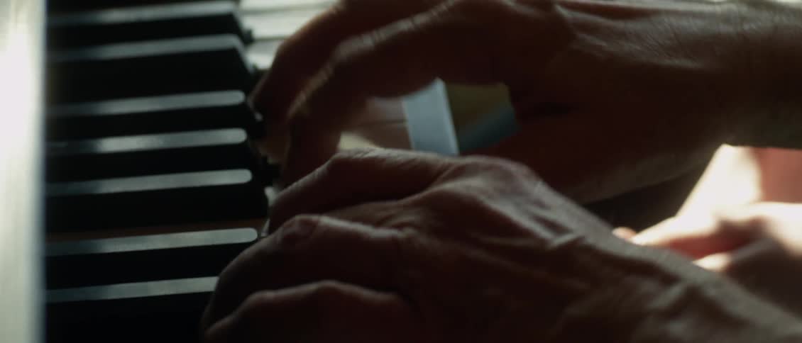 A man is playing the piano