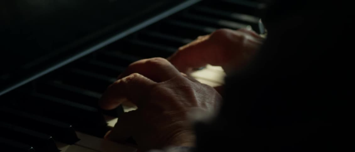 Older person plays the piano